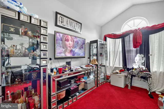 a room with furniture and a flat screen tv