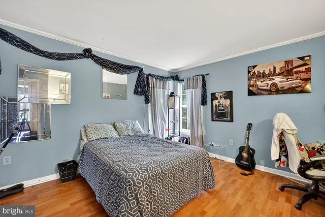 a bedroom with a bed and a dresser