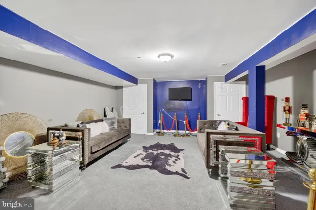 a bedroom with furniture and a flat screen tv