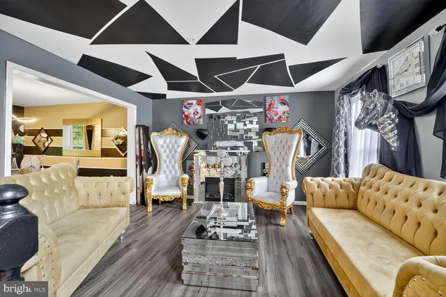 a living room with fireplace furniture and a fireplace