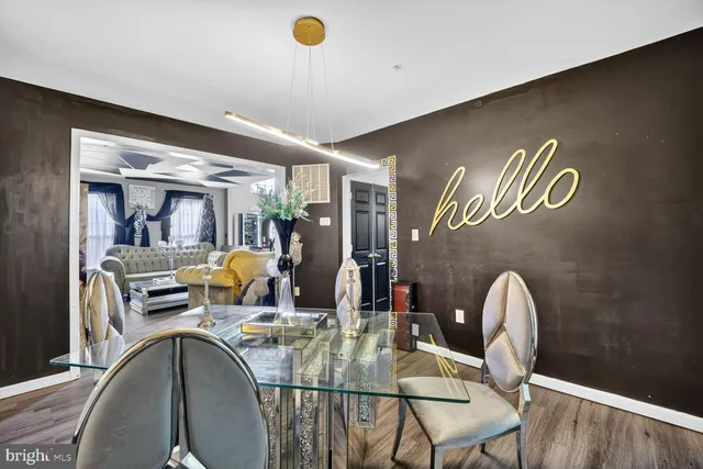 a dining room with furniture and wooden floor