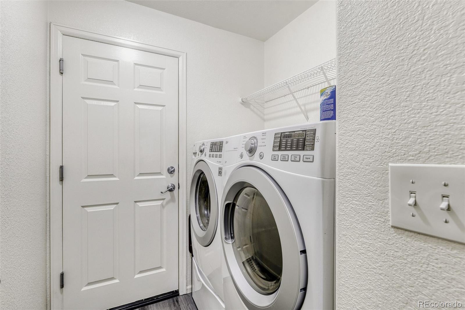 7085 Leopard Gate Lone Tree, CO 80124 - Photo 18 of 26 a utility room with dryer and washer