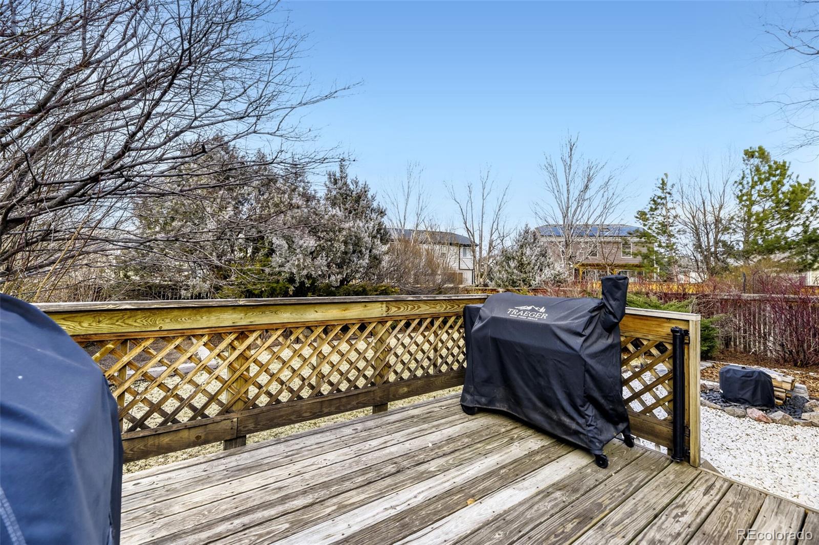 7085 Leopard Gate Lone Tree, CO 80124 - Photo 19 of 26 a view of a wooden deck with wooden floor and fence