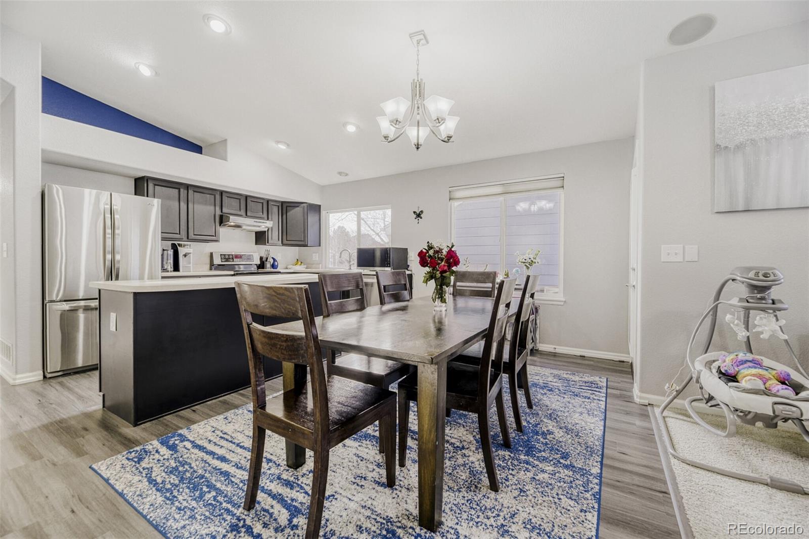 7085 Leopard Gate Lone Tree, CO 80124 - Photo 6 of 26 a view of a dining room with furniture