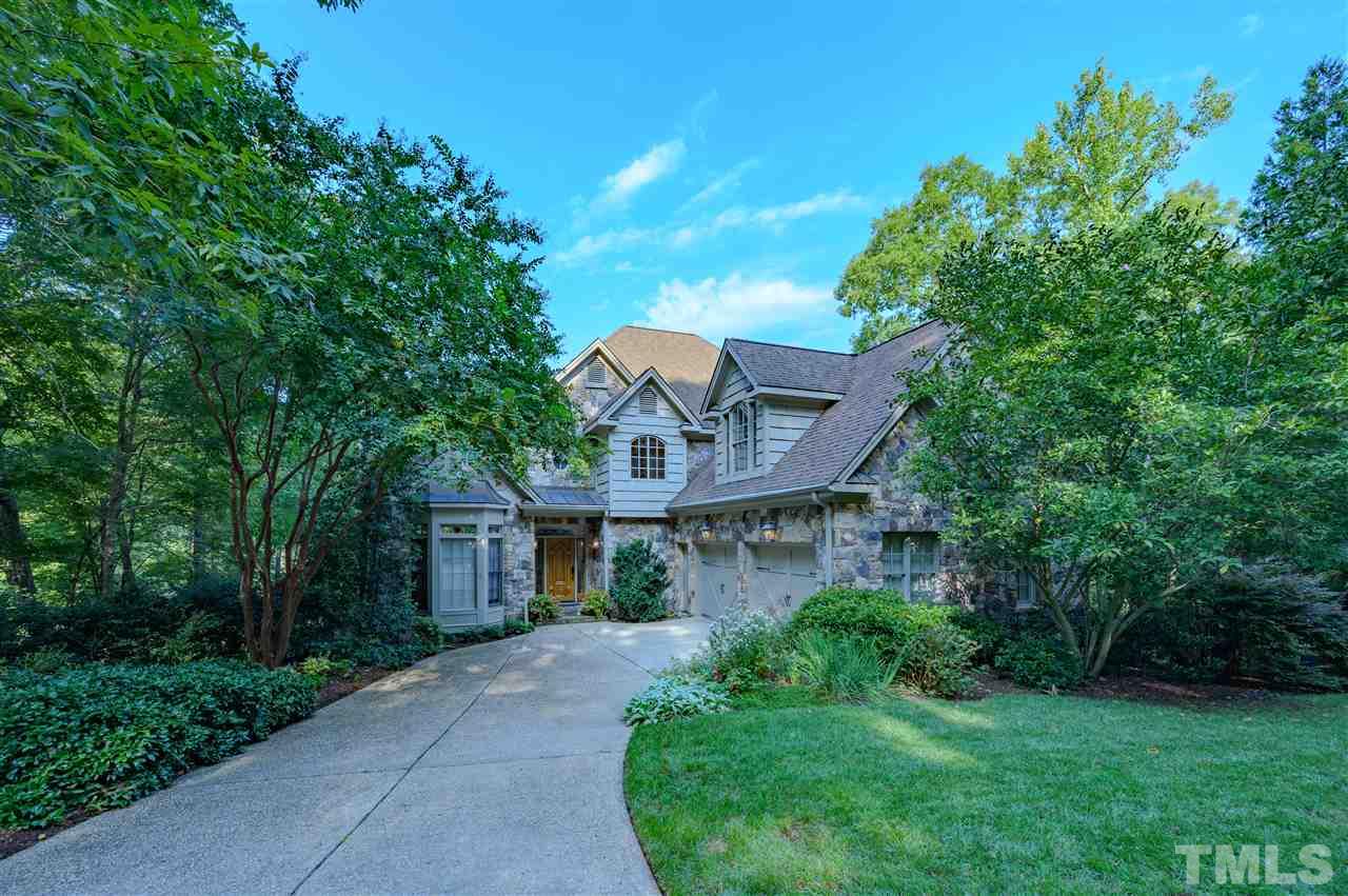 317 Homestead Drive Cary, NC 27513 - Photo 1 of 30 a front view of a house with a garden