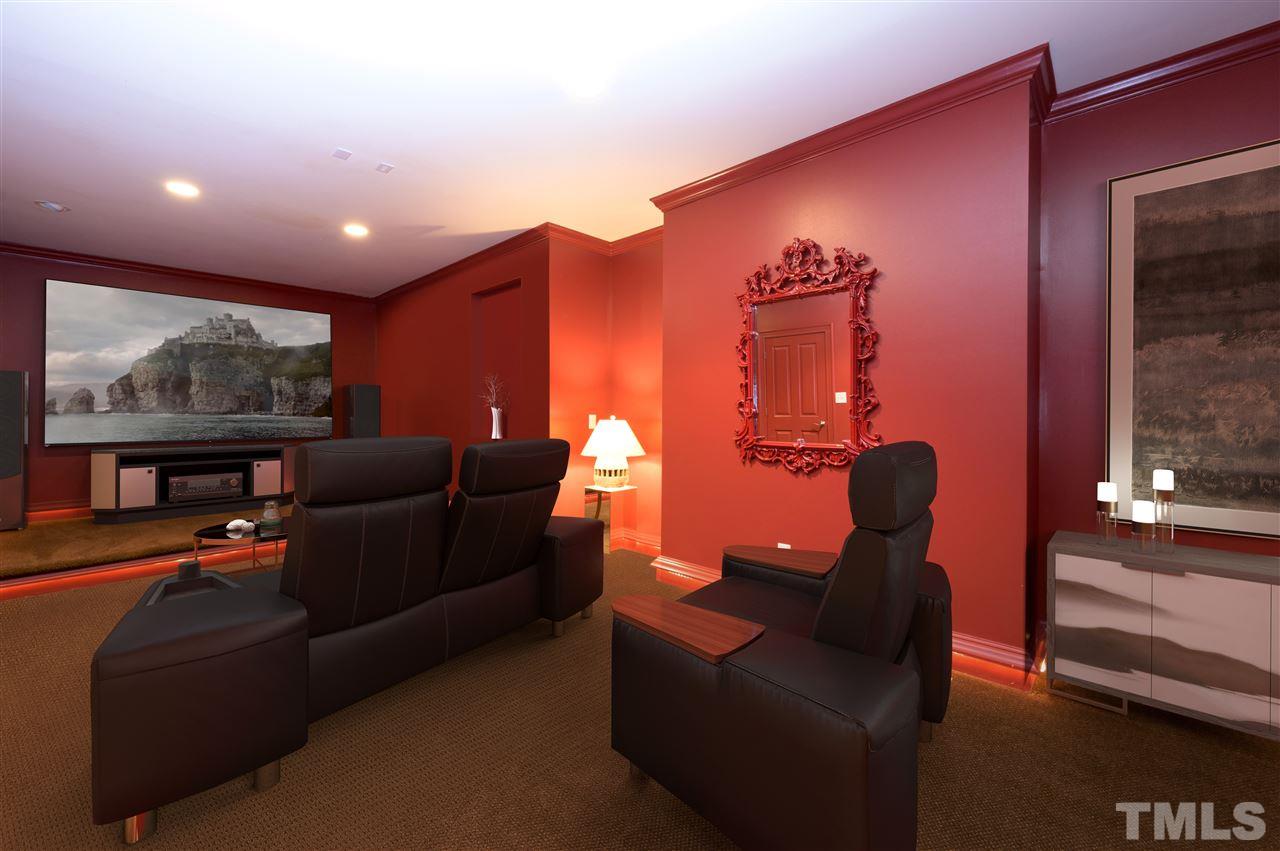 317 Homestead Drive Cary, NC 27513 - Photo 17 of 30 a projector room with furniture and a floor to ceiling window