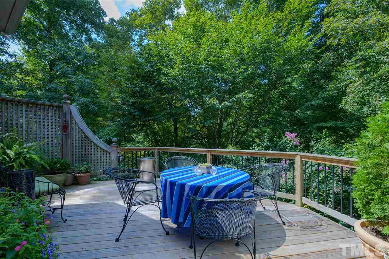 317 Homestead Drive Cary, NC 27513 - Photo 21 of 30 a view of deck with furniture and trees
