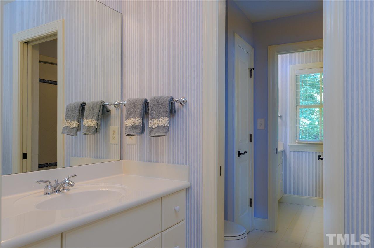 317 Homestead Drive Cary, NC 27513 - Photo 25 of 30 a bathroom with a sink and a mirror