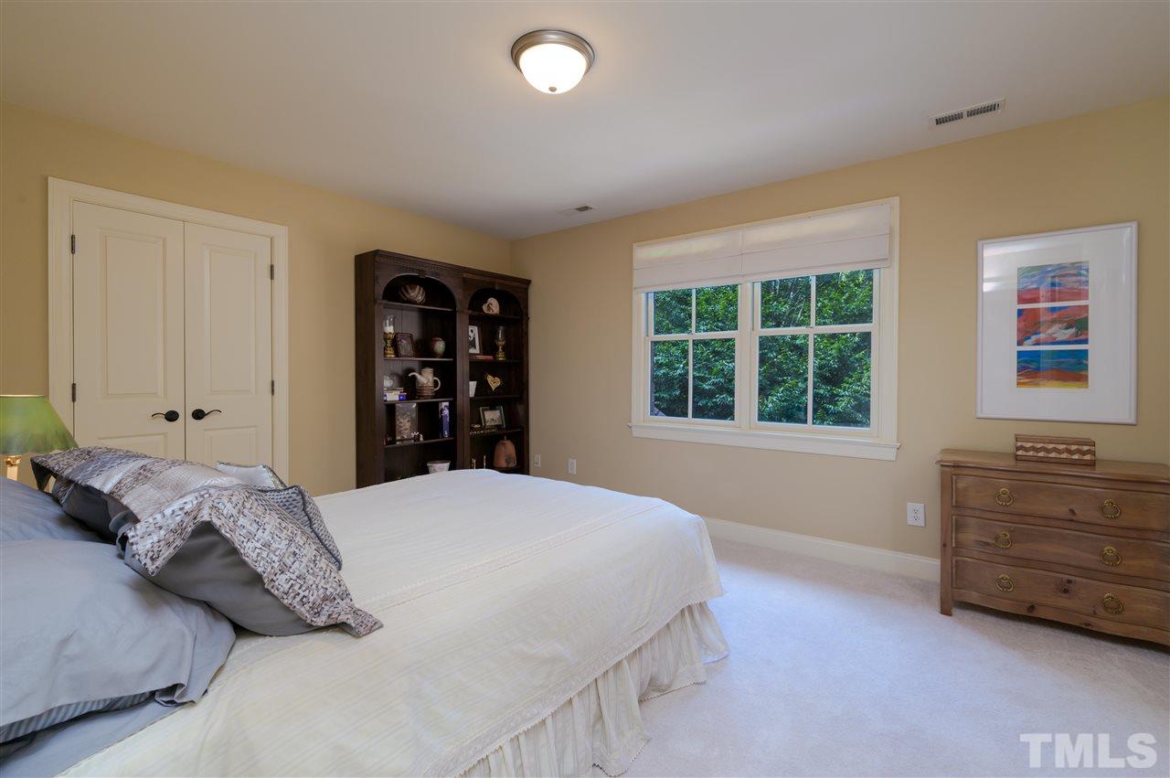 317 Homestead Drive Cary, NC 27513 - Photo 26 of 30 a bedroom with a bed and a window