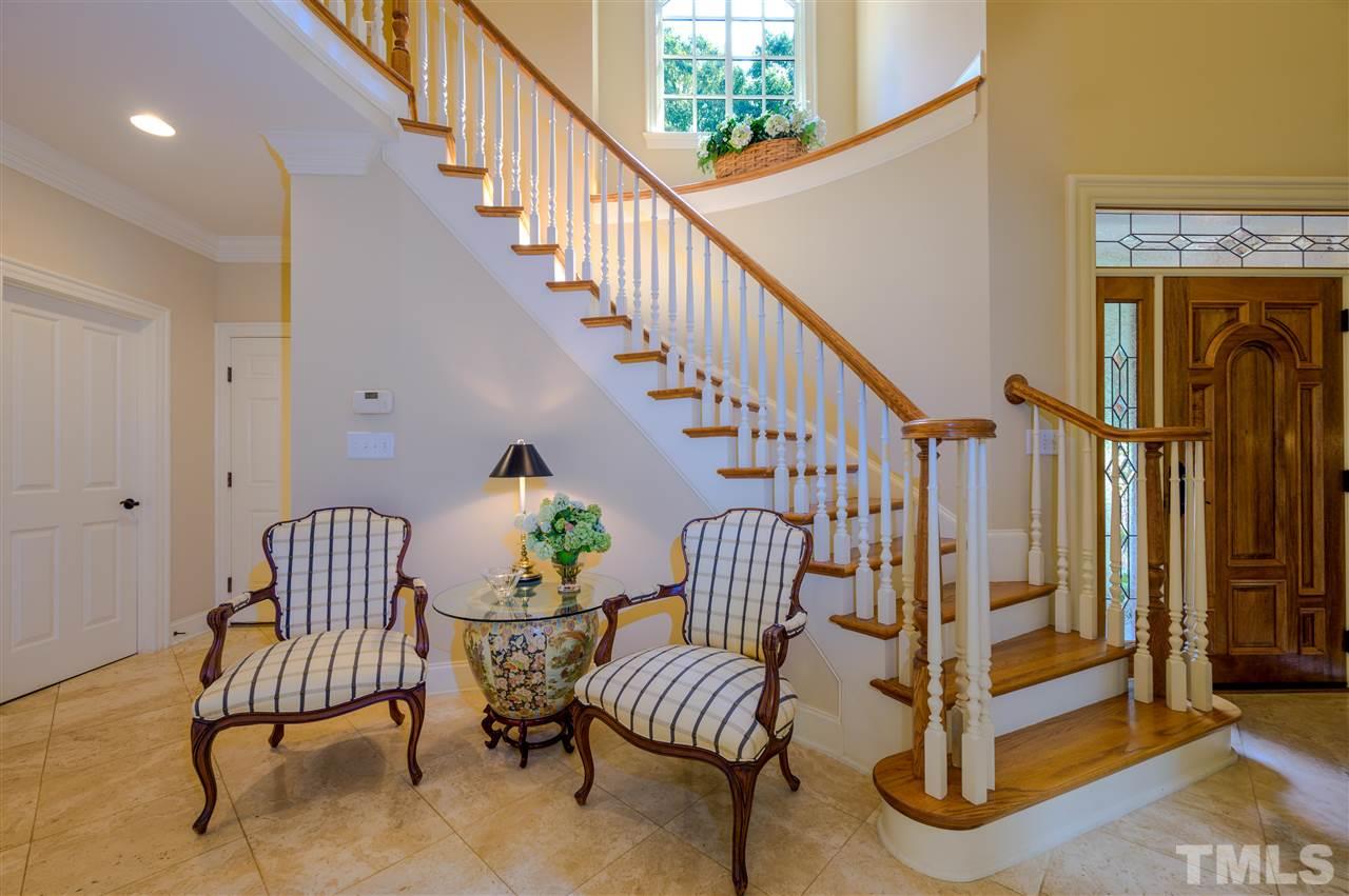 317 Homestead Drive Cary, NC 27513 - Photo 9 of 30 a view of entryway with wooden floor and stairs