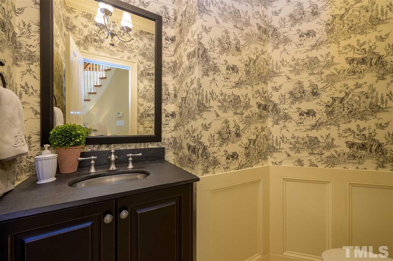 317 Homestead Drive Cary, NC 27513 - Photo 10 of 30 a bathroom with a sink and a mirror