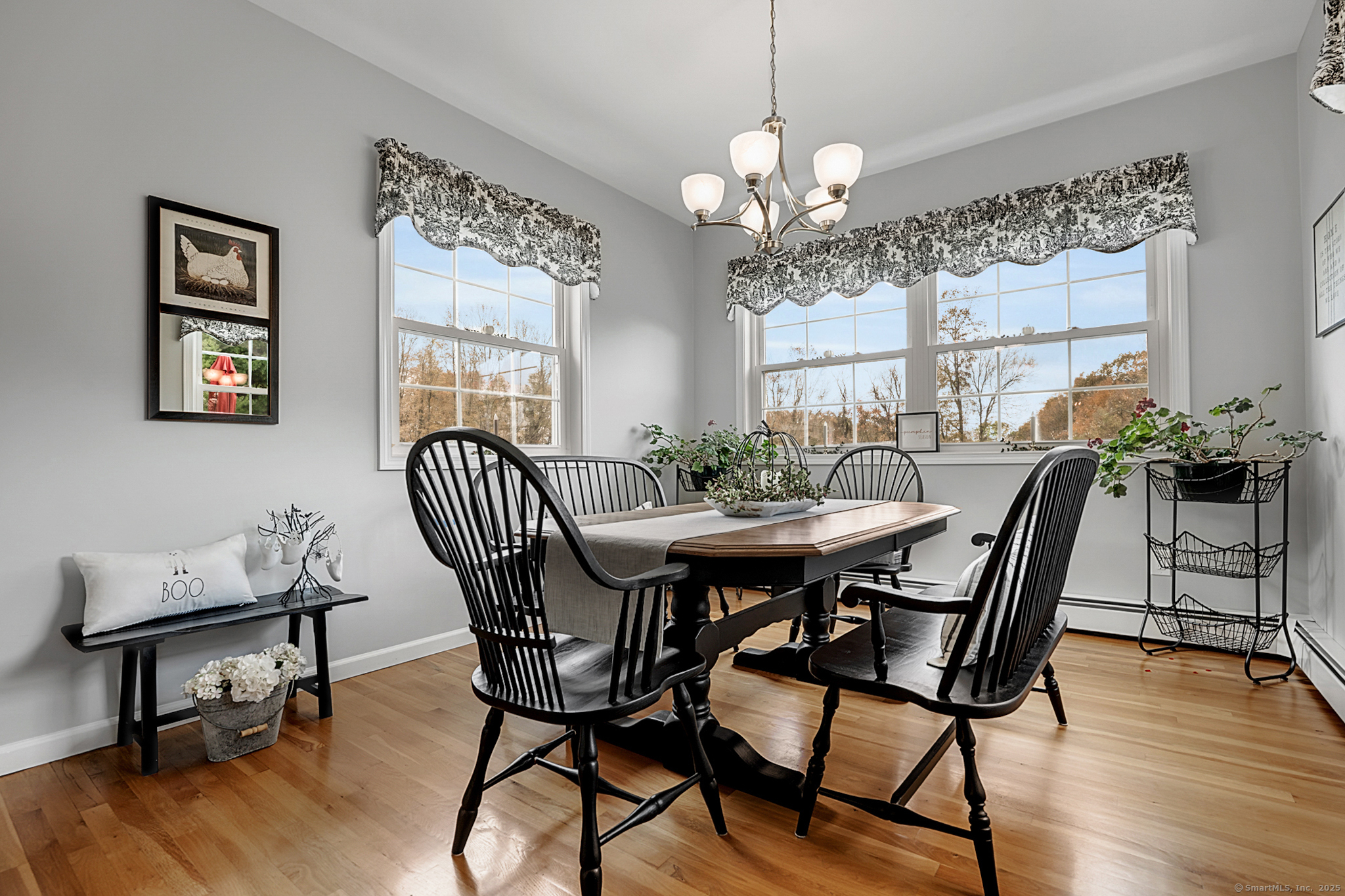 20 Cowles Road Bethlehem, CT 06751 - Photo 13 of 36 a view of a dining room with furniture window and wooden floor