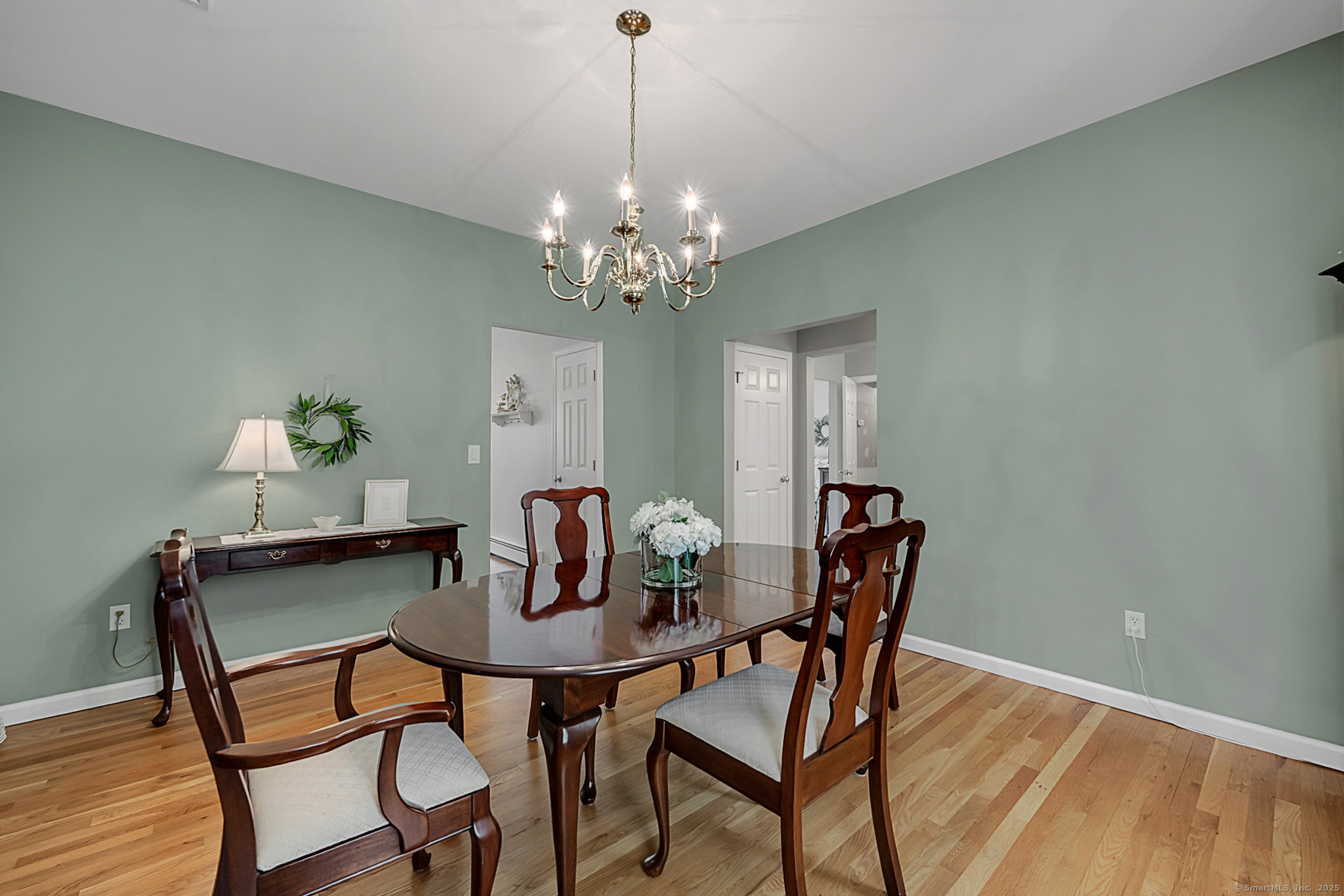 20 Cowles Road Bethlehem, CT 06751 - Photo 15 of 36 a dining room with furniture a chandelier and wooden floor