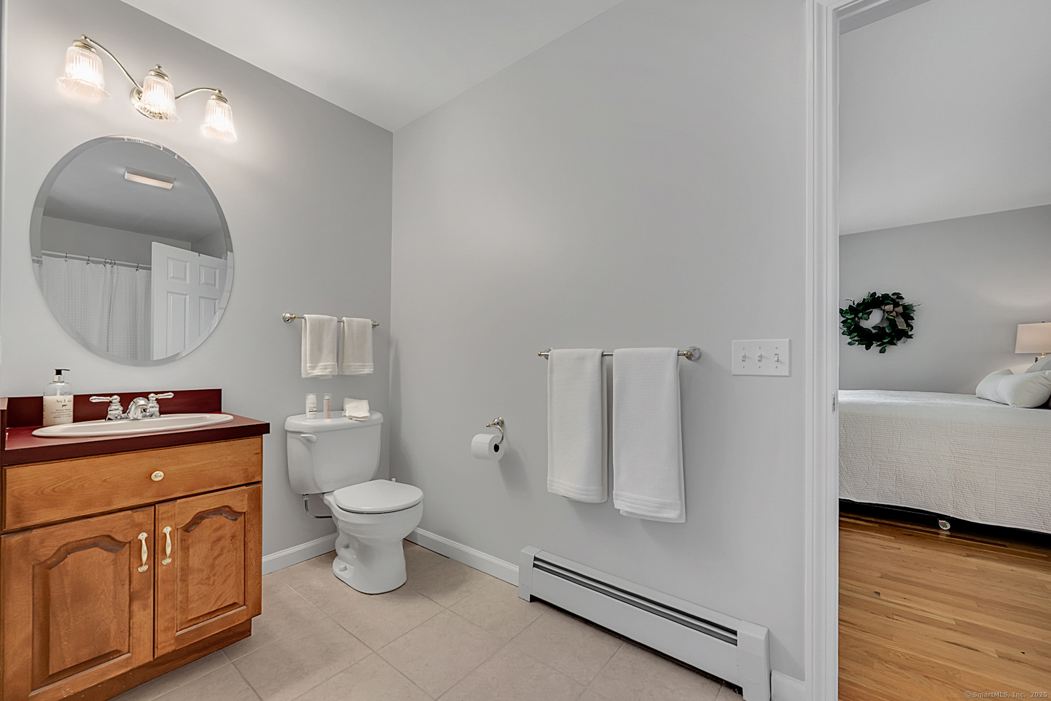 20 Cowles Road Bethlehem, CT 06751 - Photo 23 of 36 a bathroom with a toilet sink and mirror
