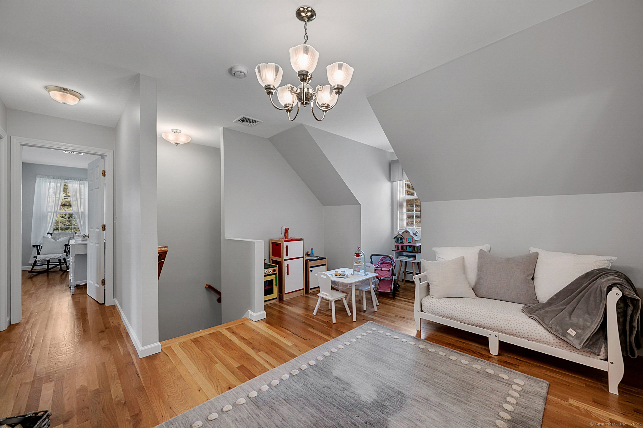 20 Cowles Road Bethlehem, CT 06751 - Photo 29 of 36 a living room with furniture and a chandelier