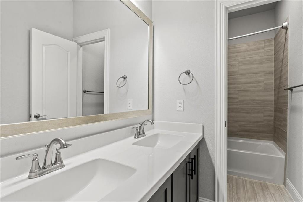 620 Shadow Trail Frisco, TX 75033 - Photo 36 of 36 Double vanity with integrated sinks and brushed nickel faucets