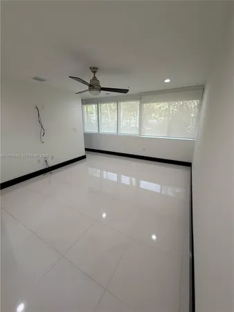 a bathroom with a shower and toilet