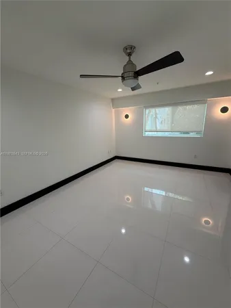 a bathroom with a sink vanity and a toilet