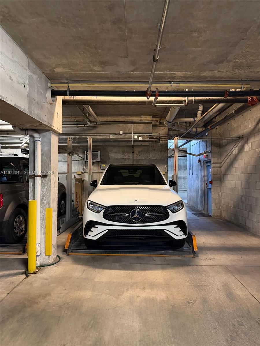 2699 Tigertail Avenue, Unit 14 Miami, FL 33133 - Photo 21 of 28 a car parked in garage