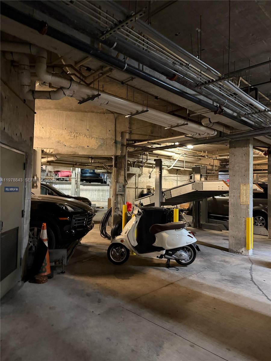 2699 Tigertail Avenue, Unit 14 Miami, FL 33133 - Photo 22 of 28 a view of parking garage with cars