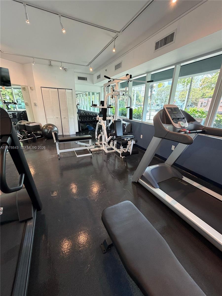 2699 Tigertail Avenue, Unit 14 Miami, FL 33133 - Photo 25 of 28 a view of a room with gym equipment