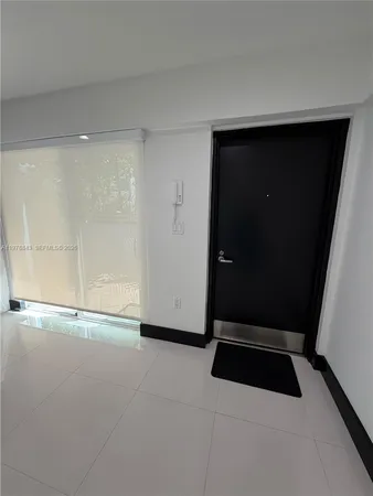 a bathroom with a sink and a large mirror