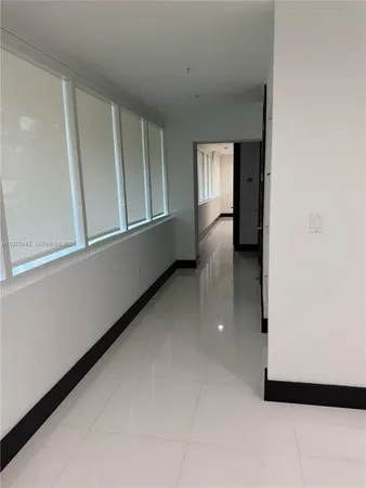 a kitchen with stainless steel appliances kitchen island granite countertop a stove and a refrigerator