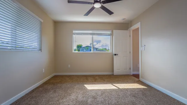 a bathroom with a double vanity sink mirror and toilet