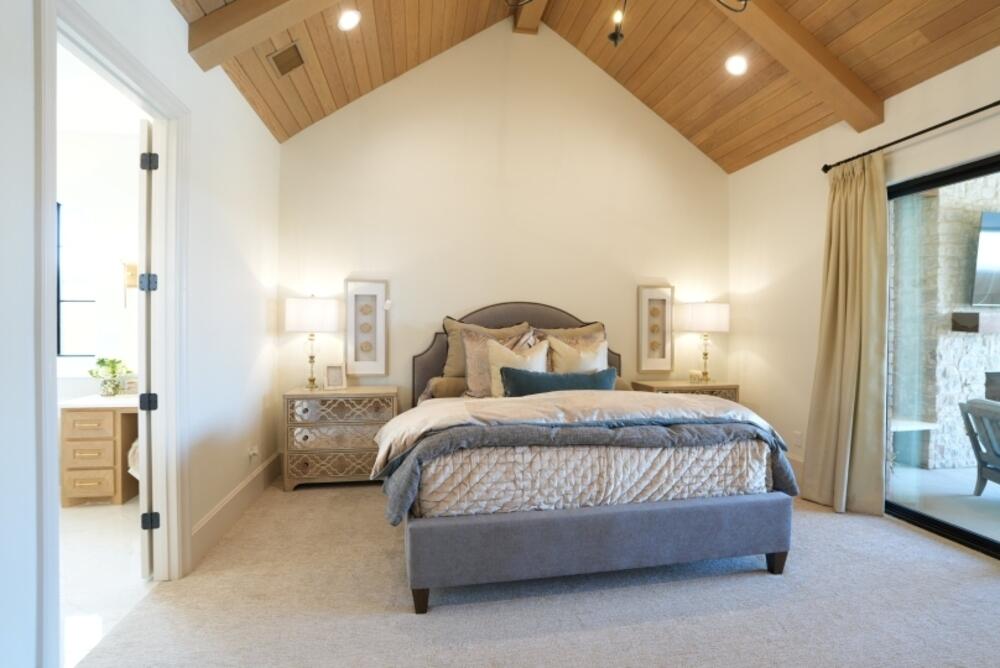4101 149th Street Lubbock, TX 79423 - Photo 27 of 53 a bedroom with a bed and a night stand