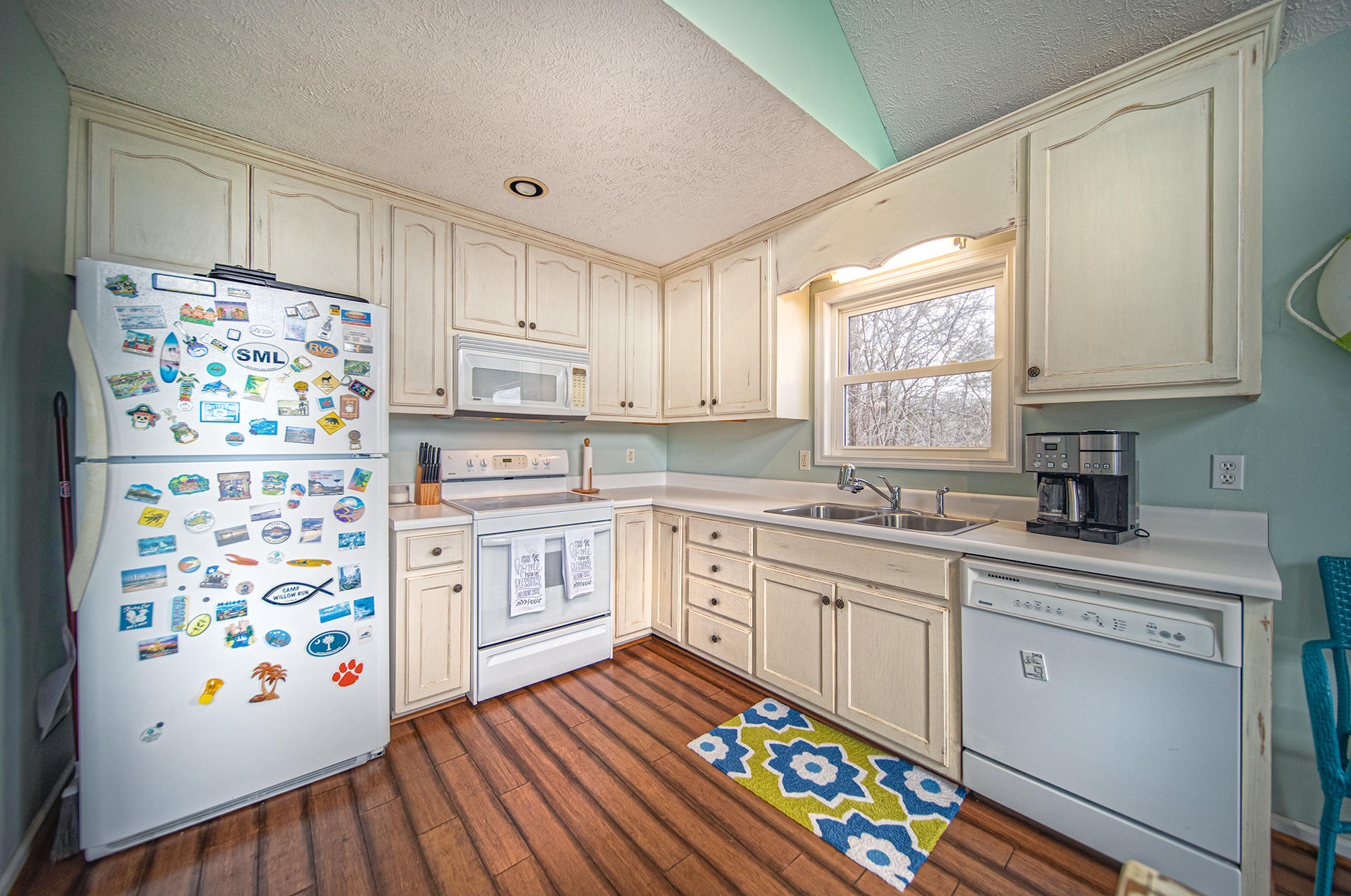 6136 Horseshoe Bend Road Goodview, VA 24095 - Photo 11 of 35 a kitchen with stainless steel appliances a stove a sink and a refrigerator