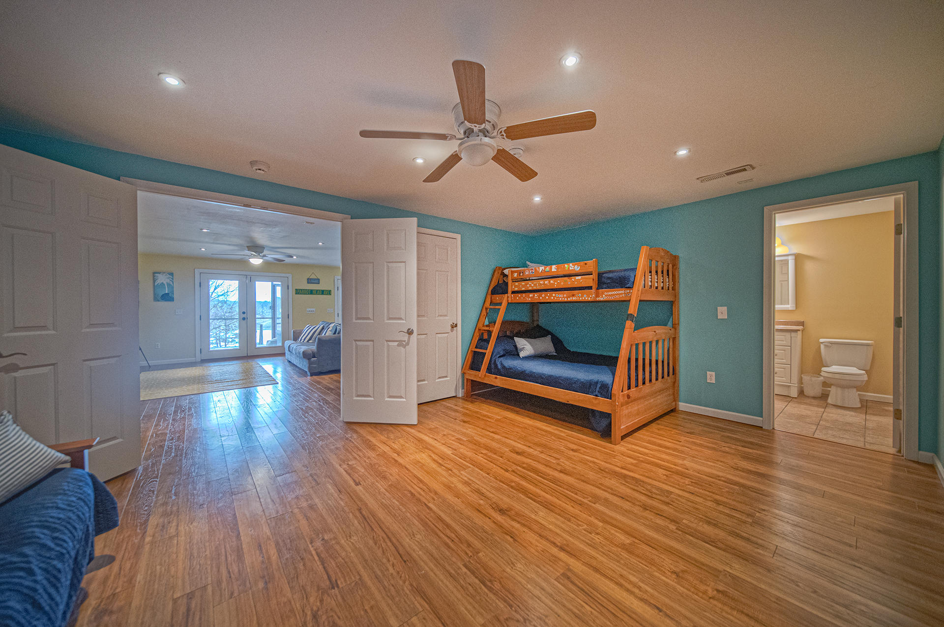 6136 Horseshoe Bend Road Goodview, VA 24095 - Photo 16 of 35 a living room with hard wood floors and a ceiling fan