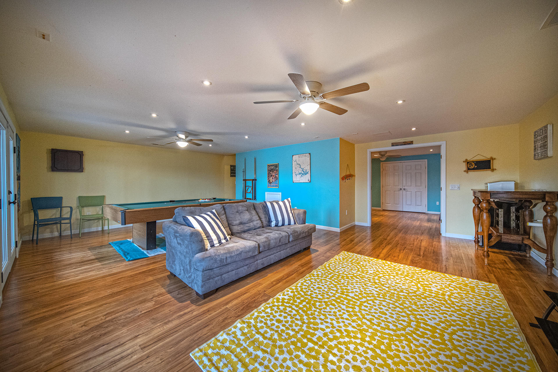 6136 Horseshoe Bend Road Goodview, VA 24095 - Photo 23 of 35 a living room with furniture and a dining table with wooden floor
