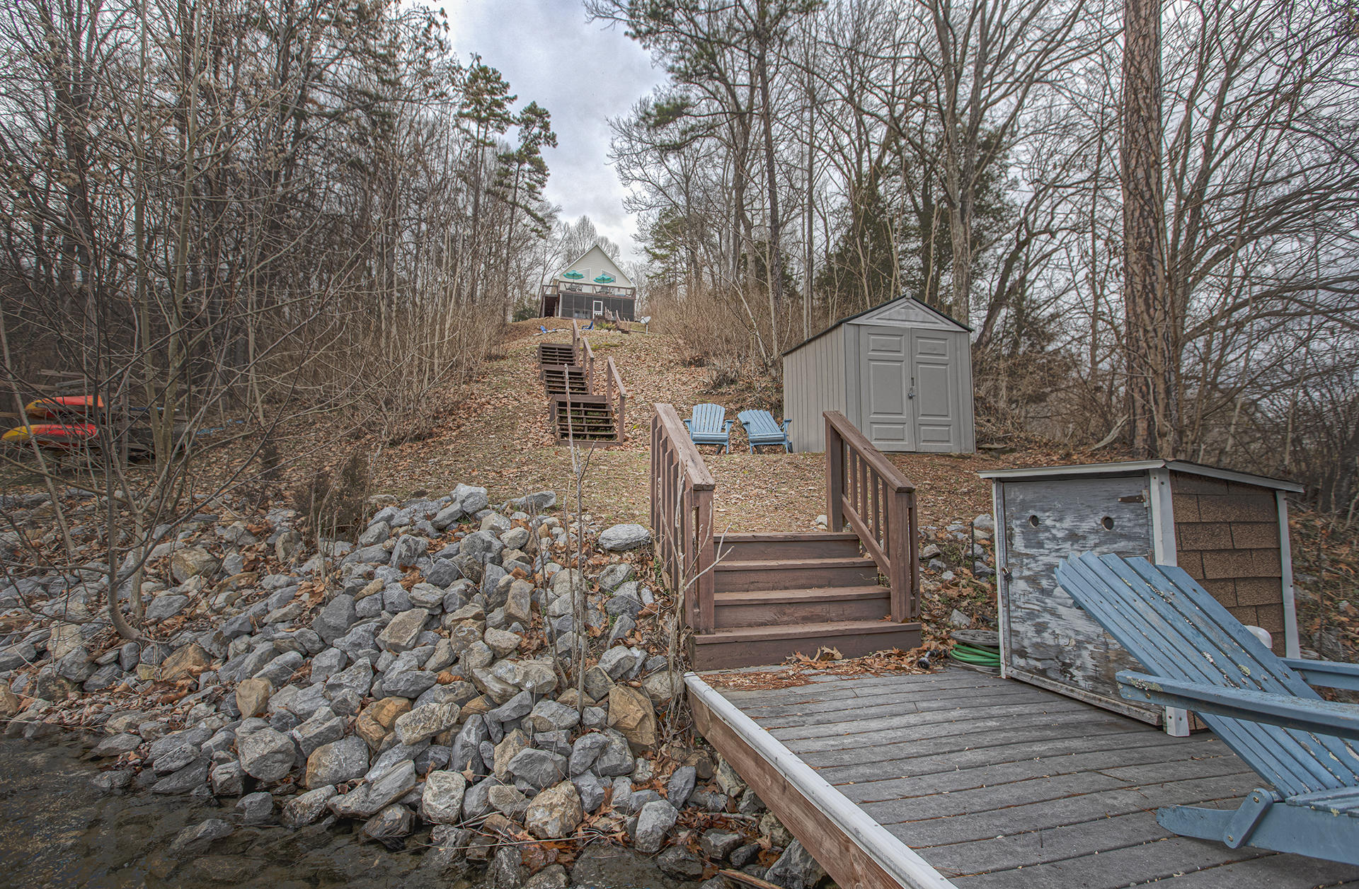 6136 Horseshoe Bend Road Goodview, VA 24095 - Photo 32 of 35 a view of a house with wooden deck and trees