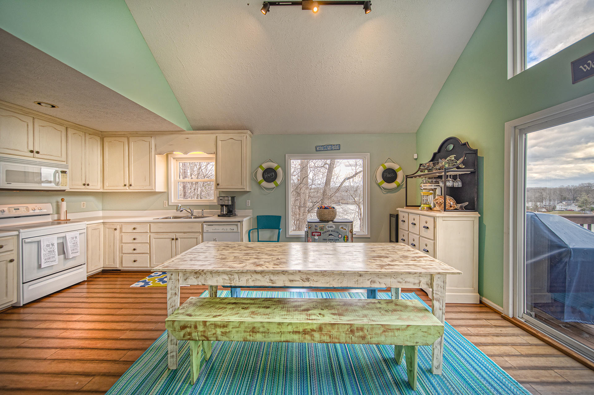 6136 Horseshoe Bend Road Goodview, VA 24095 - Photo 10 of 35 a large kitchen with stainless steel appliances granite countertop a stove and a refrigerator