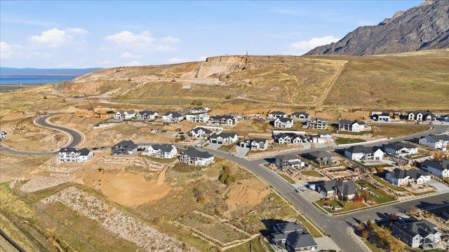 1211 West Fallow Way Ogden, UT 84414 - Photo 15 of 20 Aerial view of property's location with nearby suburban area and a mountain backdrop