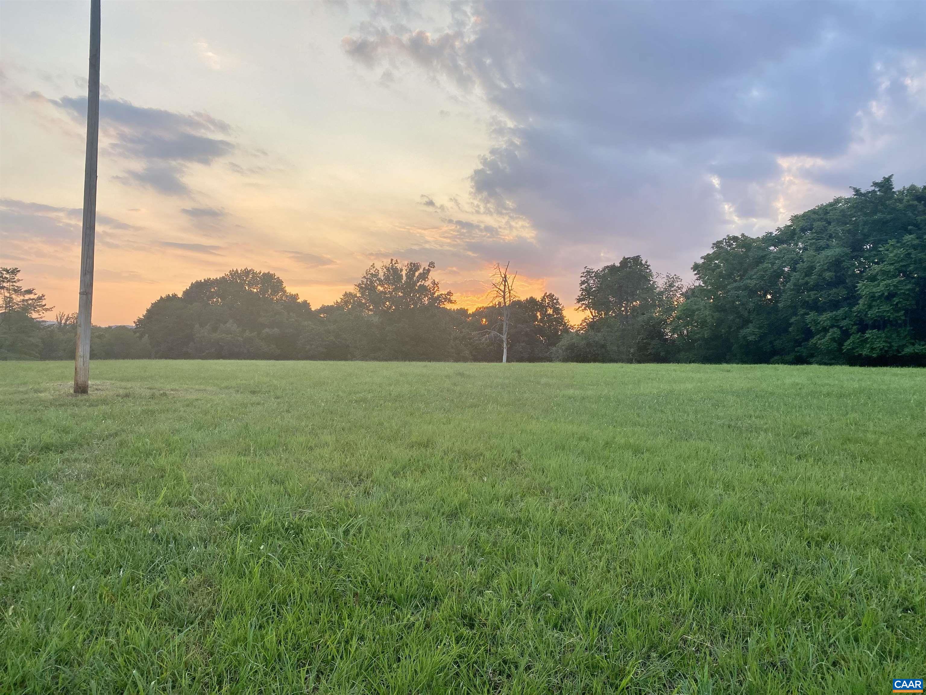 695 Patrick Henry Highway Amherst, VA 24521 - Photo 11 of 16 a view of a green field with wooden fence