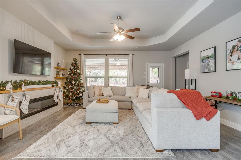 5821 Rendyn Court Midlothian, TX 76065 - Photo 15 of 30 a living room with furniture and a flat screen tv