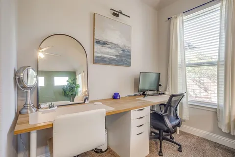 a bathroom with a sink double vanity and a mirror