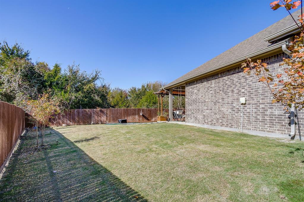 5821 Rendyn Court Midlothian, TX 76065 - Photo 30 of 30 a view of a backyard with a tree