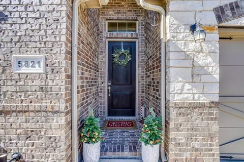a front view of a house with a glass door