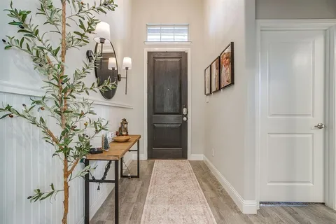 a kitchen with refrigerator a microwave and cabinets