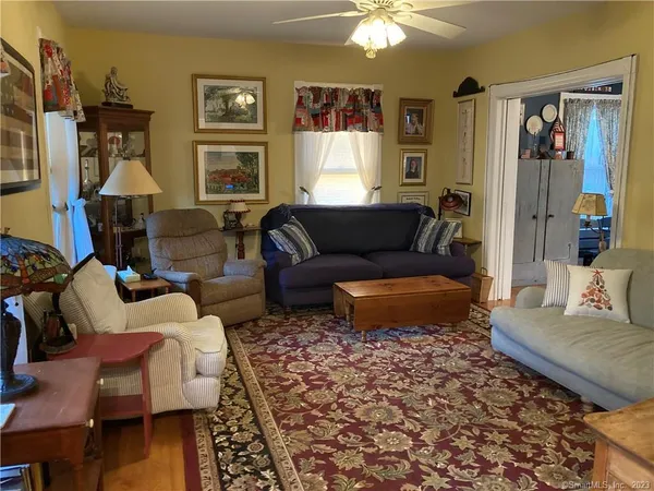 a living room with furniture and a window