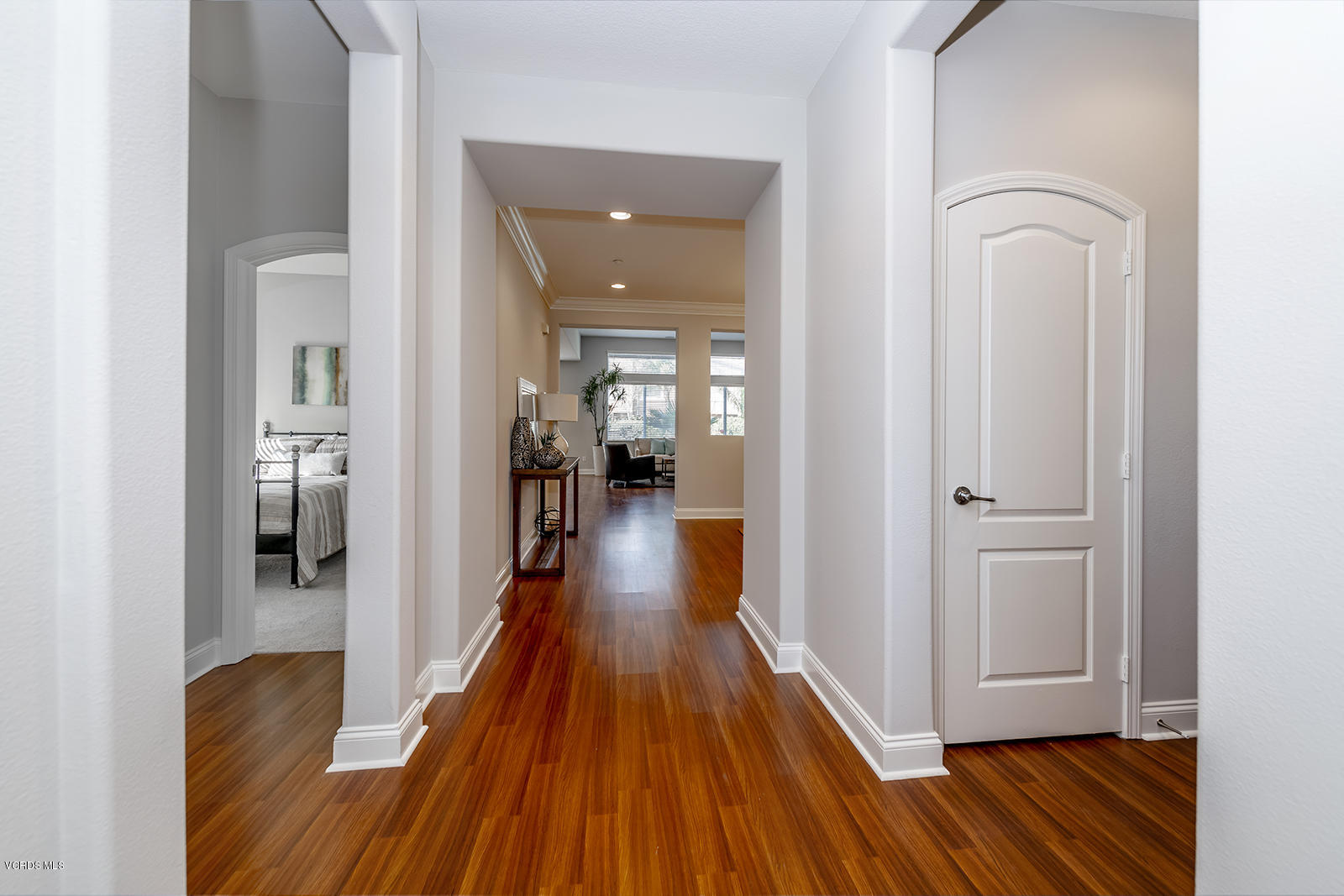 641 Riviera Court Oxnard, CA 93035 - Photo 2 of 18 a view of a hallway with wooden floor