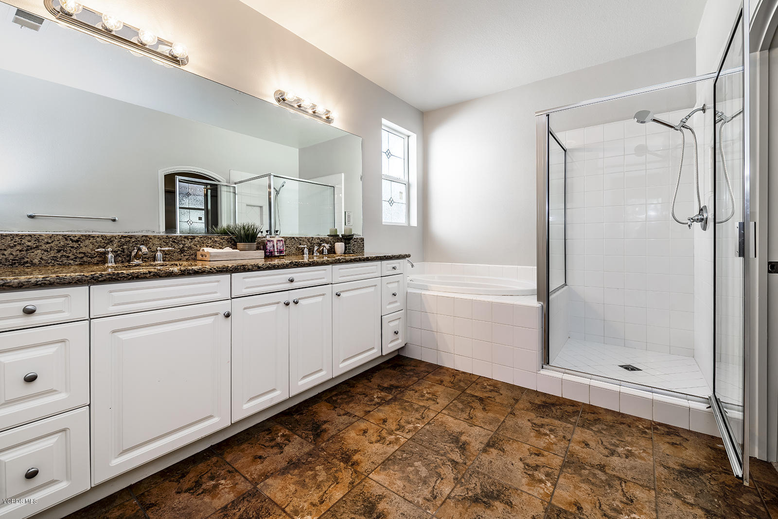641 Riviera Court Oxnard, CA 93035 - Photo 12 of 18 a bathroom with a sink and a mirror