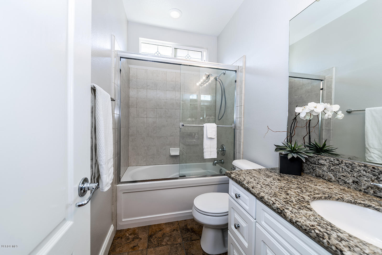 641 Riviera Court Oxnard, CA 93035 - Photo 15 of 18 a bathroom with a granite countertop sink toilet and shower