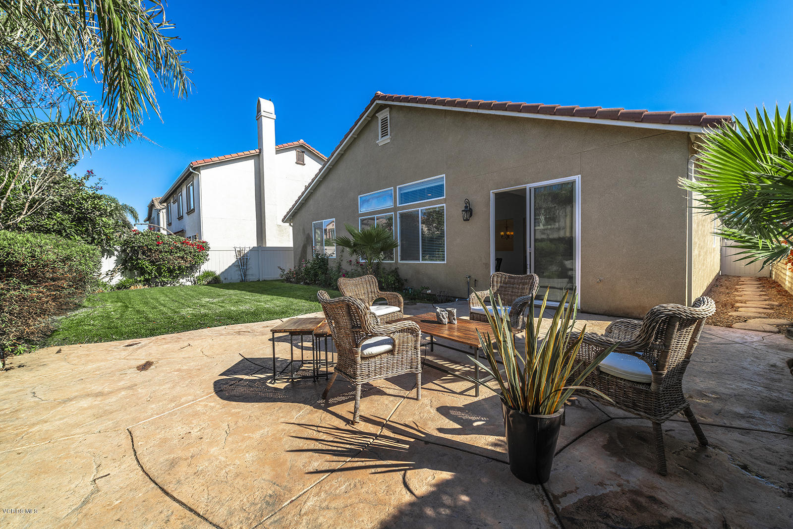 641 Riviera Court Oxnard, CA 93035 - Photo 18 of 18 a view of a patio with table and chairs and potted plants