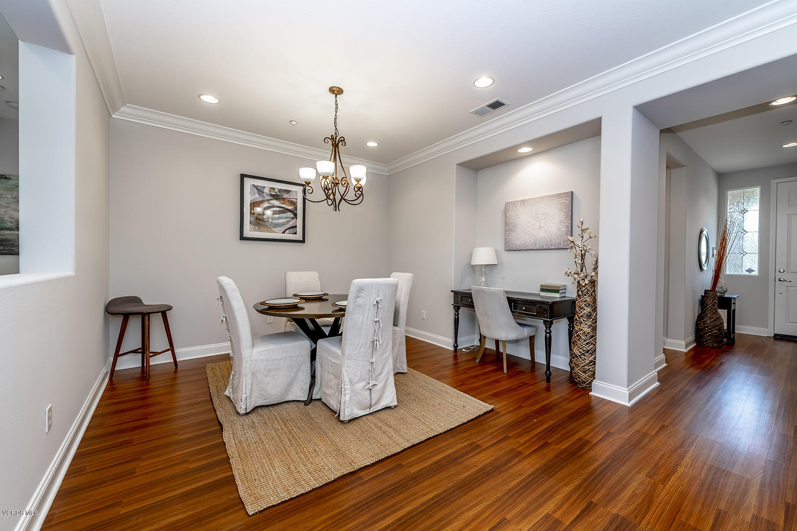 641 Riviera Court Oxnard, CA 93035 - Photo 3 of 18 a view of a dining room with furniture and wooden floor