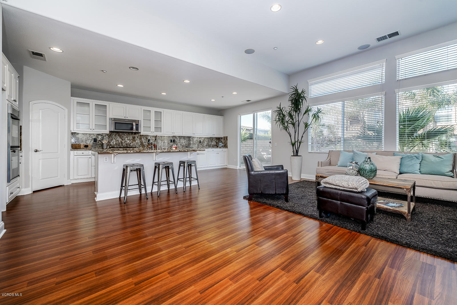 641 Riviera Court Oxnard, CA 93035 - Photo 10 of 18 a living room with furniture and a wooden floor
