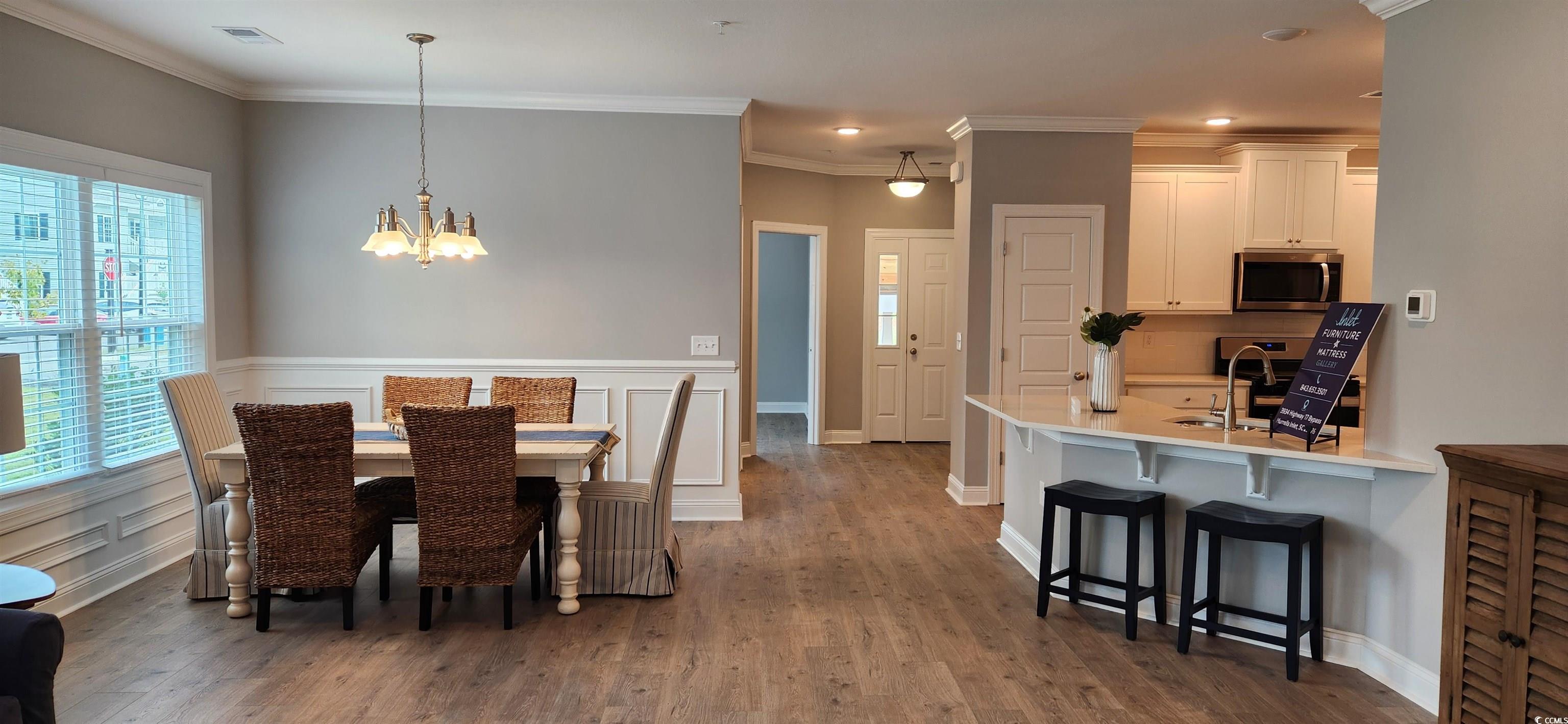 1407 Gooseneck Place, Unit 102 Murrells Inlet, SC 29576 - Photo 14 of 39 Dining room with hardwood / wood-style flooring, a