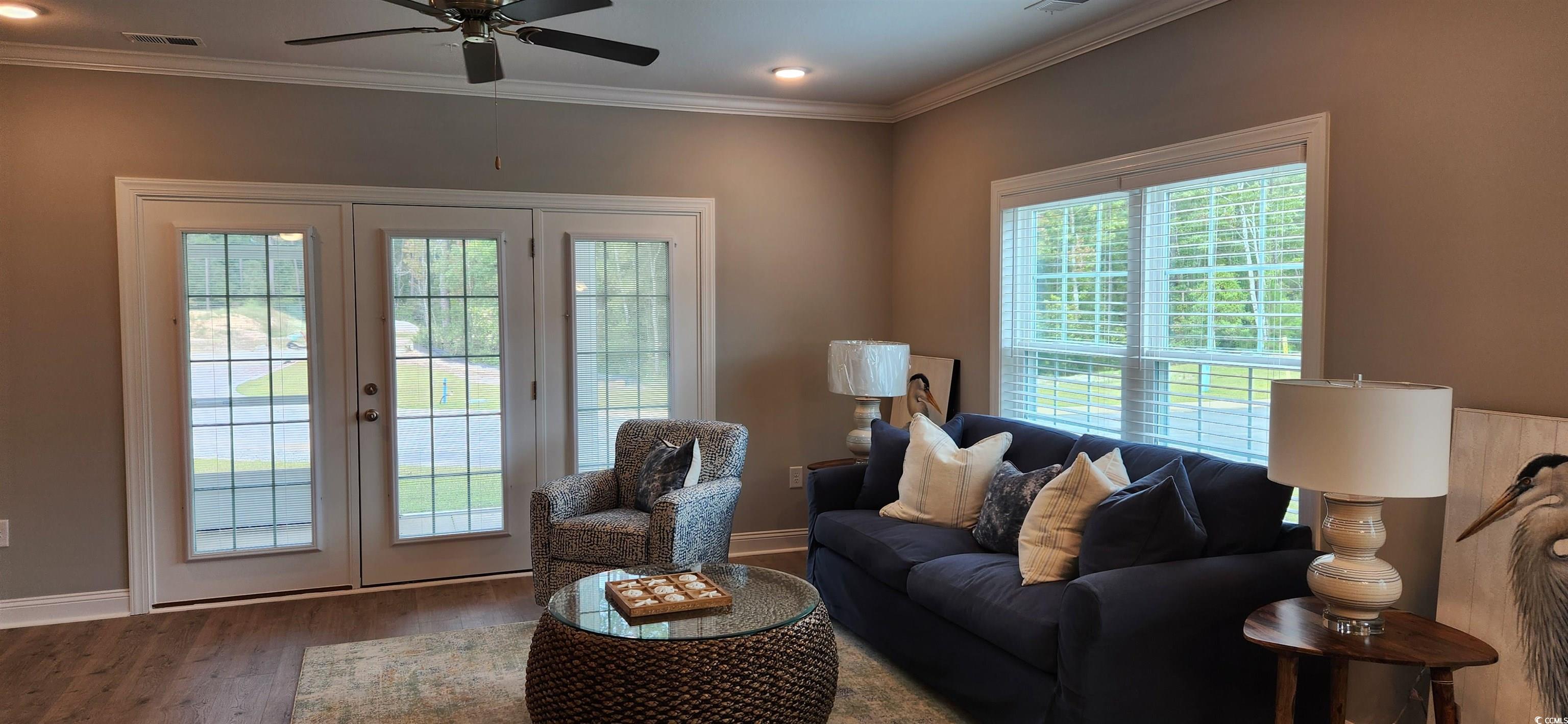 1407 Gooseneck Place, Unit 102 Murrells Inlet, SC 29576 - Photo 15 of 39 Living room featuring ornamental molding, ceiling